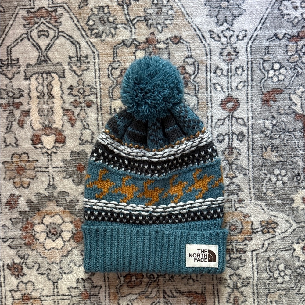 The North Face Teal Pom Pom Knit Beanie with Mustard Accent
